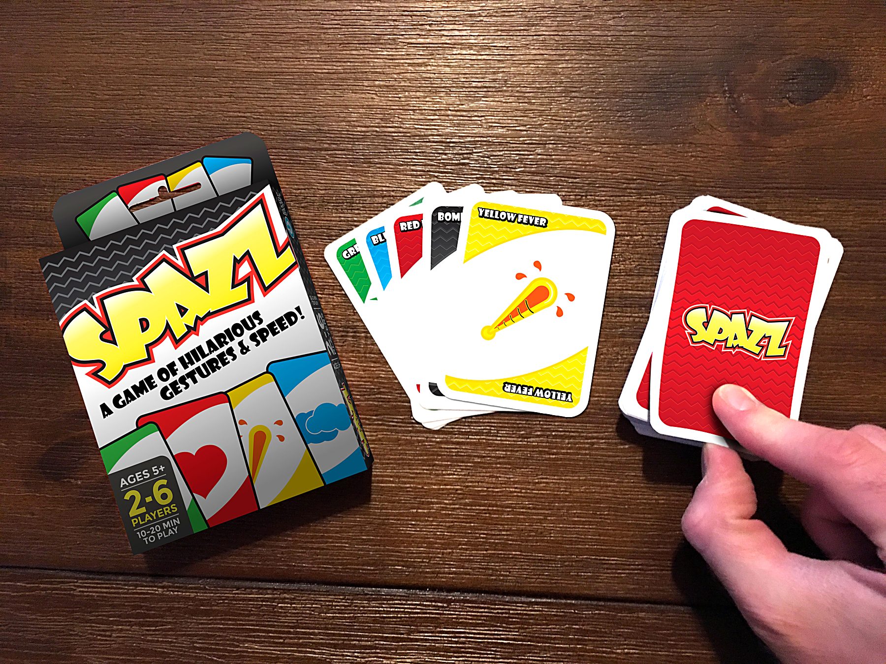 Spazz card game box and cards on a table